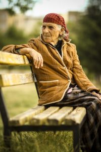 Elderly sitting on bench