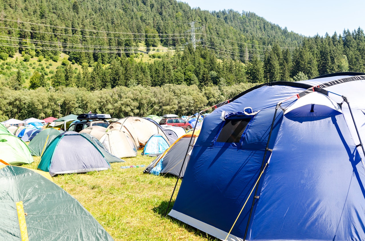 a cramped campsite full of tents